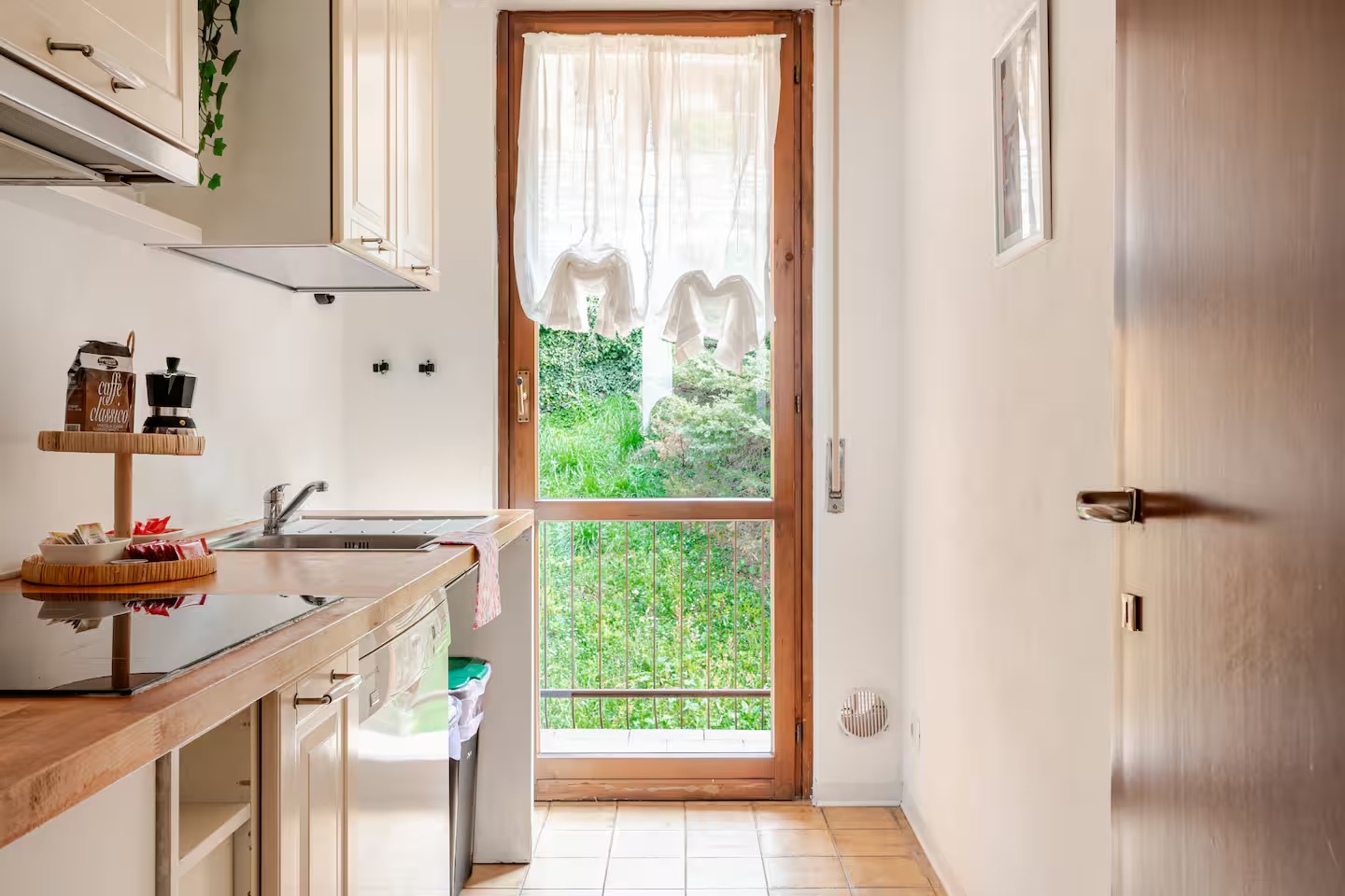 Kitchen with glass door to the terrace